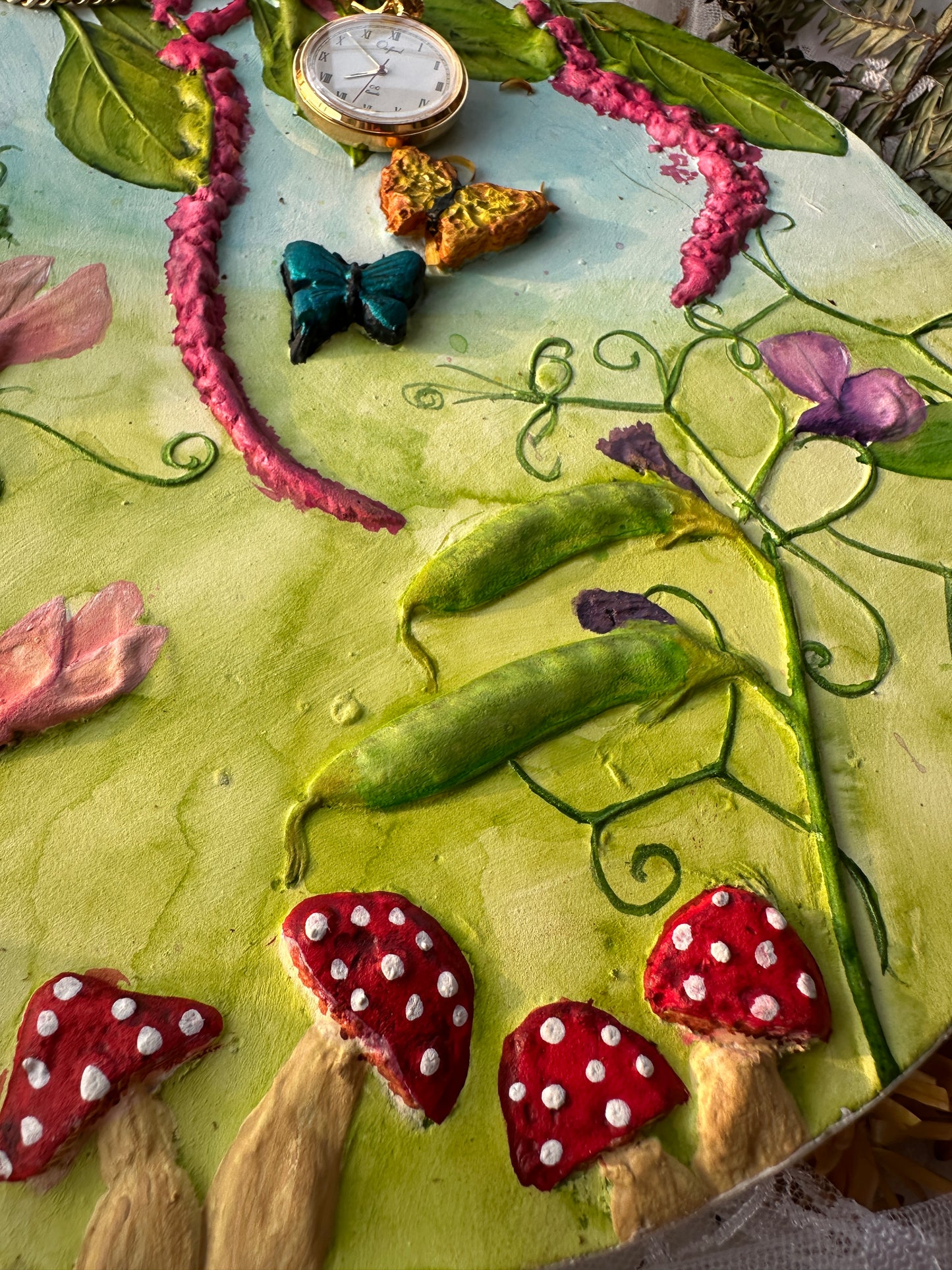 Close-up of hand-painted amaranths and sweet peas on a botanical tablet